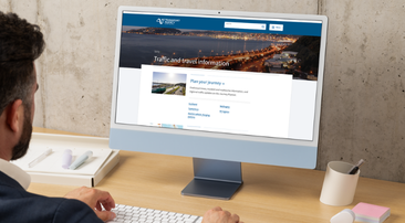 man sitting at computer with NZTA website open